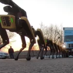 Boston Dynamics SpotMini robots pull a truck